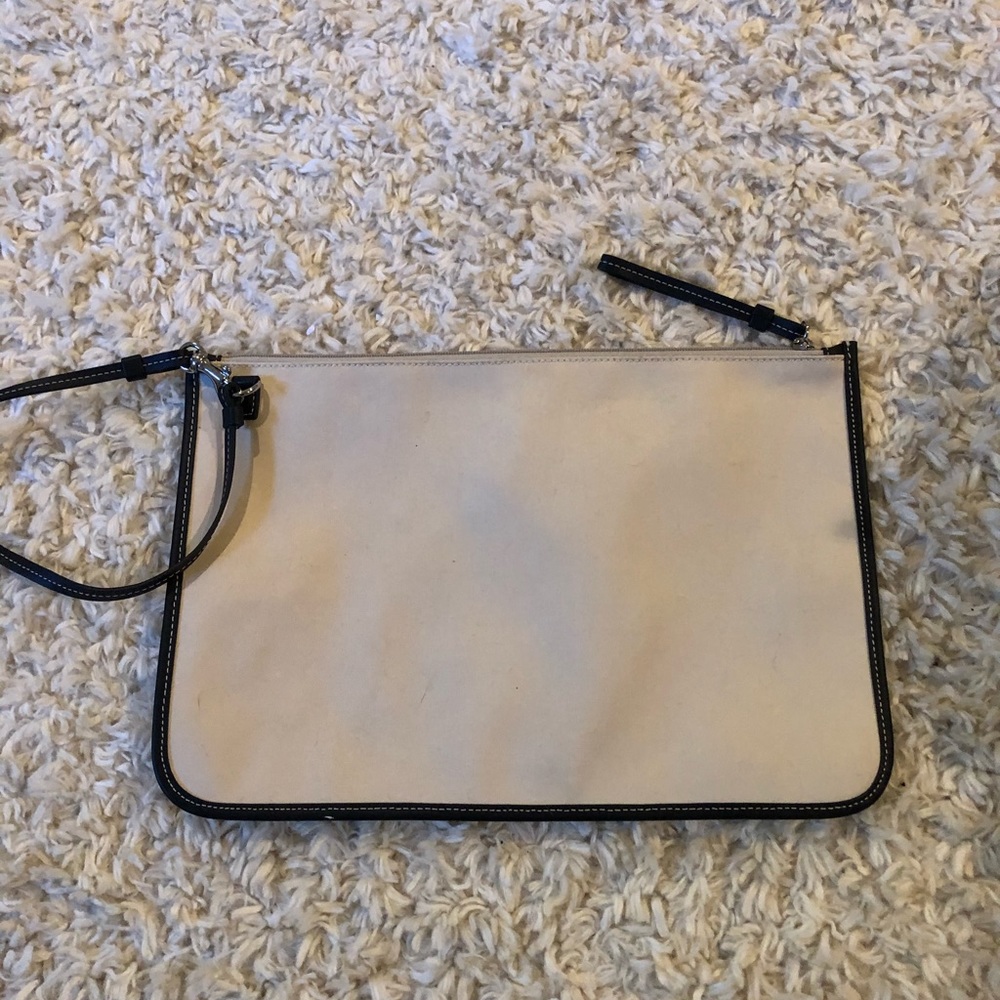 Fabric wristlet/leather trim. No markings/hangtag.
